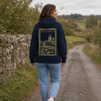Woman wearing the navy Armagh Heritage Hoodie from the back on a quiet orchard lane